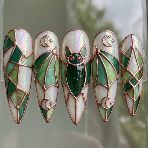 20 Halloween Nail Ideas With Ghosts, Bats and Spooky Details 13 Emerald Stained-Glass Bats