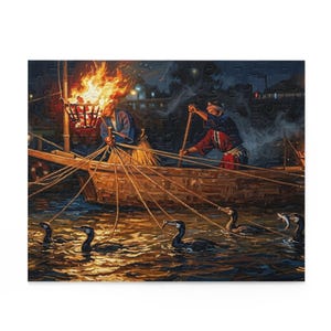 May include: A jigsaw puzzle depicting a night scene of traditional cormorant fishing from a wooden boat. Two figures in dark robes manage multiple leashed birds in the water, illuminated by a bright orange fire burning in a metal basket.