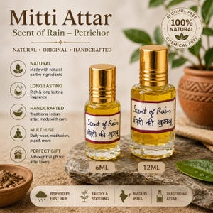 May include: Two glass bottles of Mitti Attar perfume oil with gold caps, labelled Scent of Rain in English and Hindi. The smaller bottle is 6ml and the larger is 12ml. The oil is golden yellow, and the bottles feature white labels with red borders.