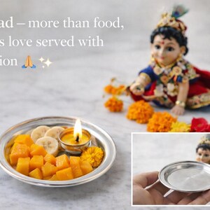May include: A silver plate with diced mango, banana slices, and a lit candle. The image includes a decorative figurine and text that reads "Prasad - more than food, it's his love served with devotion."