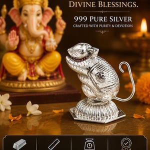 May include: A silver mouse figurine with a textured body and a long tail, standing on a hexagonal base. The text reads: PURE SILVER. DIVINE BLESSINGS. 999 PURE SILVER CRAFTED WITH PURITY & DEVOTION. MATERIAL 999 PURE SILVER, SIZE 3.5 CM (L) APPROX., WEIGHT 10.48 GM APPROX.