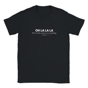 May include: A black short-sleeve t-shirt featuring the white text OH LA LA LA followed by the phrase The French answer to everything. Below the text is a small horizontal line colored in blue, white, and red, mimicking the French flag.