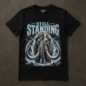 Still Standing Shirt, Woolly Mammoth Tee, Prehistoric Survival, Ice Blue Animal Graphic, Dark Winter Nature, Resilience Gift, Reaper Reps image 1