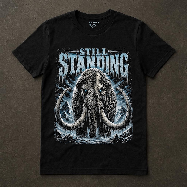 Still Standing Shirt, Woolly Mammoth Tee, Prehistoric Survival, Ice Blue Animal Graphic, Dark Winter Nature, Resilience Gift, Reaper Reps image 1