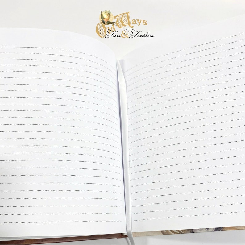 May include: An open notebook with lined pages. The notebook has a brown cover and the text "Days & Feathers" is printed on the cover.
