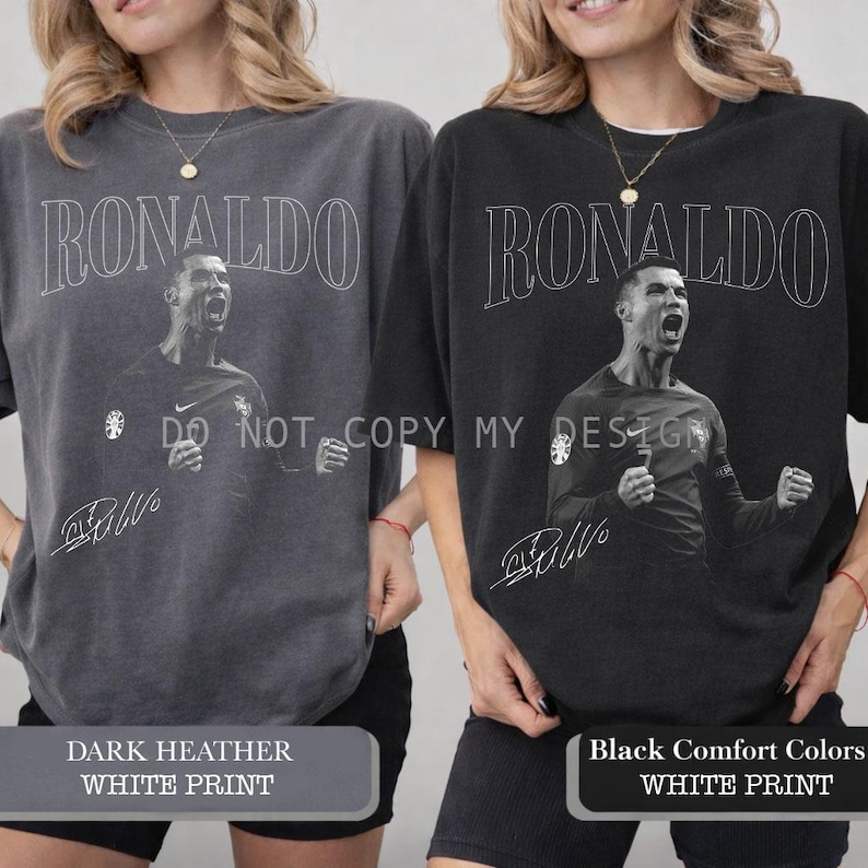 May include: Two oversized crewneck sweatshirts, one dark heather gray and one black, each featuring a white graphic of Cristiano Ronaldo and his signature. The word "RONALDO" is printed above the image.