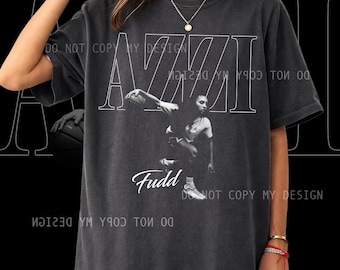 Camiseta unisex Azzi Fudd de edición limitada: Ropa unisex de algodón para baloncesto con estampado de la WNBA.