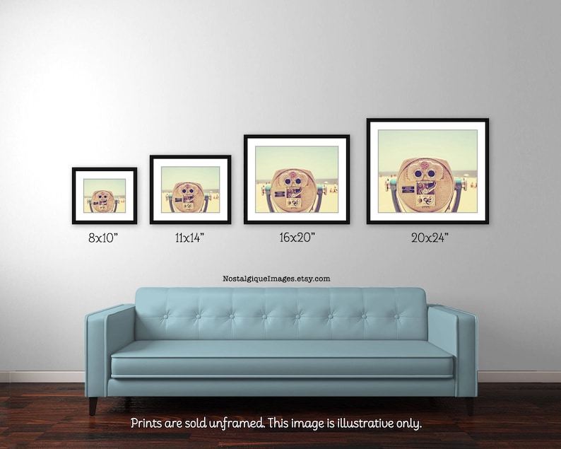 May include: A vintage photograph of a seaside viewfinder with a beach scene in the background. The viewfinder is a wooden structure with a lens on the front. The photo is available in four sizes: 8x10 inches, 11x14 inches, 16x20 inches, and 20x24 inches.