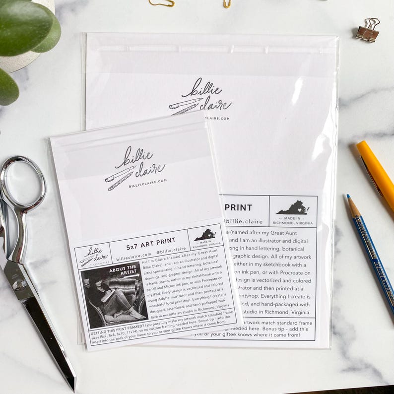 May include: Two clear plastic sleeves containing art prints. The prints are labeled "5x7 ART PRINT" and feature the "billie claire" logo. The packaging includes text about the artist and the print's origin in Richmond, Virginia.