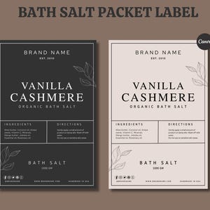 May include: Two bath salt packet labels. One is black, the other is beige. Both feature the text "VANILLA CASHMERE ORGANIC BATH SALT". The labels include ingredient and direction sections, and the text "BATH SALT 1000 GM".
