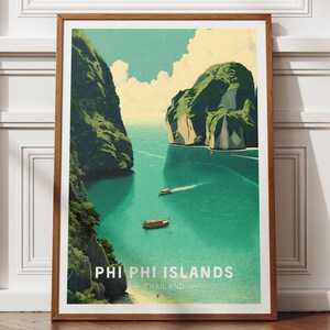 May include: A framed art print with a vintage travel poster design of the Phi Phi Islands, Thailand. The image shows a turquoise sea, green islands, and boats. The text "PHI PHI ISLANDS THAILAND" is at the bottom of the poster.