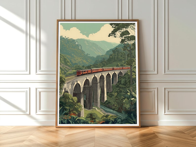 May include: A framed art print showing a red train on a stone bridge with arches, set in a green valley with mountains. The artwork has a vintage travel poster style, reminiscent of classic railway travel.