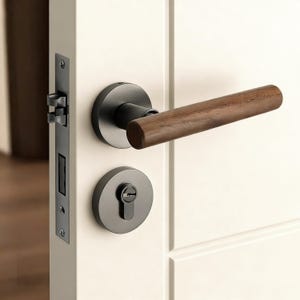 May include: A modern door handle set featuring a dark gray finish with a cylindrical, wooden handle. The set includes a round door knob and a keyhole, all mounted on a white door. The door latch is also visible.