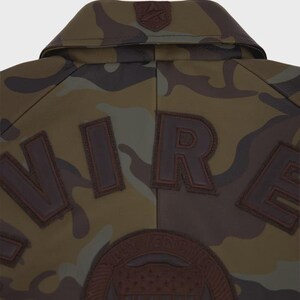 May include: A set of three ceramic mugs with a speckled, matte finish. The mugs are in shades of cream, light gray, and dark gray. Each mug has a simple, modern design and a rounded handle.