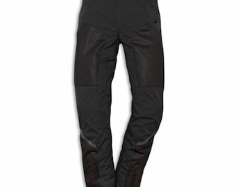 May include: Black motorcycle pants with reinforced knee and lower leg panels. The pants have a streamlined design with reflective accents and a small logo near the right pocket. The waist has a red accent.