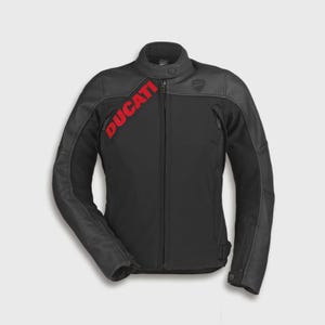 May include: A black motorcycle jacket featuring a high collar with a snap button closure, a full-length front zipper, and the word DUCATI printed in bold red letters diagonally across the right chest area, with long sleeves and zippered pockets.
