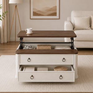May include: A white coffee table with a dark wood top that lifts to reveal a storage compartment. The table features two drawers with dark metal ring pulls. The top surface holds a white mug. The design includes a mechanism for height adjustment.
