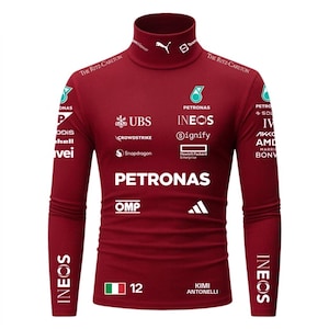 May include: A maroon long-sleeved turtleneck top with various sponsor logos and the word "PETRONAS" in white. The shirt also displays "INEOS" and the number "12".