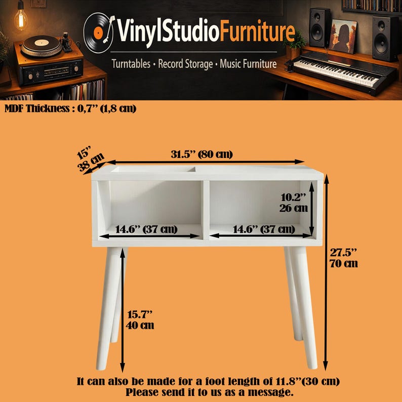May include: A white record storage console with two open compartments and four tapered legs. Dimensions include a 31.5 inch width, 15 inch depth, and 27.5 inch height. The MDF thickness is 0.7 inches. Features include 14.6 inch wide compartments.