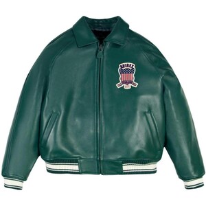 May include: A dark green leather jacket with a zip-up front, collar, and a patch on the chest. The patch features a design with the text "AVIREX" and an American flag. The jacket has white and black striped cuffs and hem.