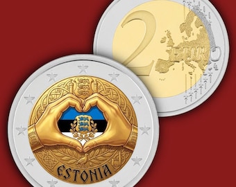 May include: A commemorative 2 euro coin featuring a gold-coloured centre and silver-coloured outer ring. The design displays two hands forming a heart shape over the blue, black, and white Estonian flag, with the text ESTONIA and the national coat of arms.