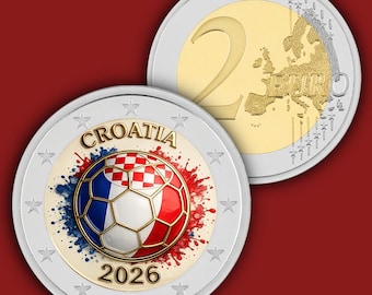 May include: A two-euro coin featuring a football design with a red and white checkered pattern, blue and red paint splatters, and the text CROATIA 2026. The reverse side shows the standard European map and the number 2 with the word EURO.
