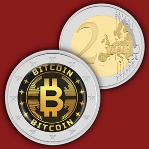 May include: A two-euro coin featuring a gold-colored center with a map of Europe and the number 2, paired with a circular token displaying a gold Bitcoin logo on a black background, surrounded by a silver border with stars and the text BITCOIN.