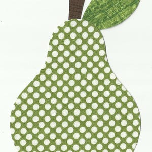 May include: A fabric pear applique with a green body covered in white polka dots. It has a brown stem and a green leaf. The design is cut out and placed on a white background.