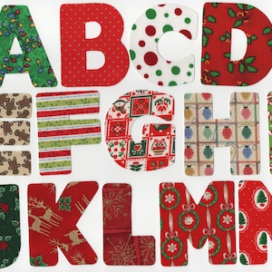May include: A collection of fabric letters, A through N, with festive Christmas patterns. The letters feature designs like Christmas lights, polka dots, gingerbread men, candy canes, and ornaments. Ideal for holiday crafts and decorations.