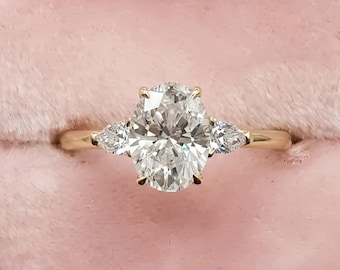 Oval Moissanite Three Stone Engagement Ring with Pear Side Stones