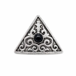 May include: A triangular silver-toned metal brooch featuring an intricate embossed scrollwork pattern and a single smooth, round black stone set in the center. The metal has a darkened, antiqued finish that highlights the detailed relief design.