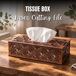 May include: A brown wooden tissue box with a decorative laser-cut design. The box has a rectangular shape with a top opening for tissue dispensing. The text "TISSUE BOX Laser Cutting file" is displayed above the box.