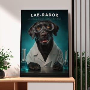 May include: A framed poster featuring a black Labrador dog wearing clear safety goggles and a white lab coat. The text reads LAB-RADOR and An enthusiastic companion in applied science. Two glass beakers with blue liquid sit on a dark table.