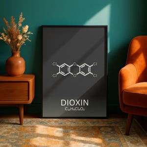 May include: A framed print featuring the molecular structure of Dioxin, with the chemical formula C12H4Cl4O2. The text and chemical structure are white against a dark gray background. The frame is black.