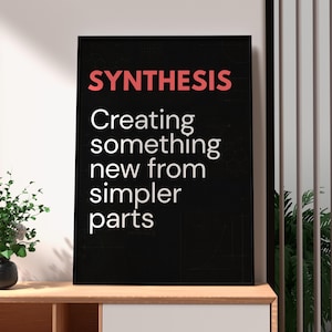 May include: A black framed wall art print featuring the word SYNTHESIS in large coral-colored capital letters at the top, followed by the white text: Creating something new from simpler parts, set against a dark background.