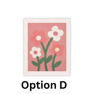 May include: A floral rug with a pink background and a white border. The rug features three pink flowers with white centers and one white flower with a pink center. Green stems and leaves support the flowers. The text "Option D" is at the bottom.
