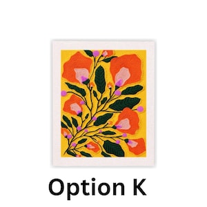 May include: A framed floral art print featuring orange and pink flowers with green leaves on a yellow background. The artwork is framed in a white textured border. The text "Option K" is printed in black at the bottom.