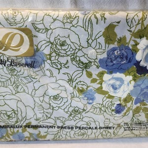 May include: A white and blue floral percale sheet in a plastic package. The sheet is labeled "Miralux Permanent Press Percale Sheet" and "Lady Pepperell".