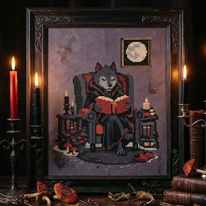 May include: Framed cross-stitch art featuring a wolf in a chair reading a book. The wolf is wearing a dark cloak and is surrounded by candles and books. The artwork has a gothic theme with a dark color palette.