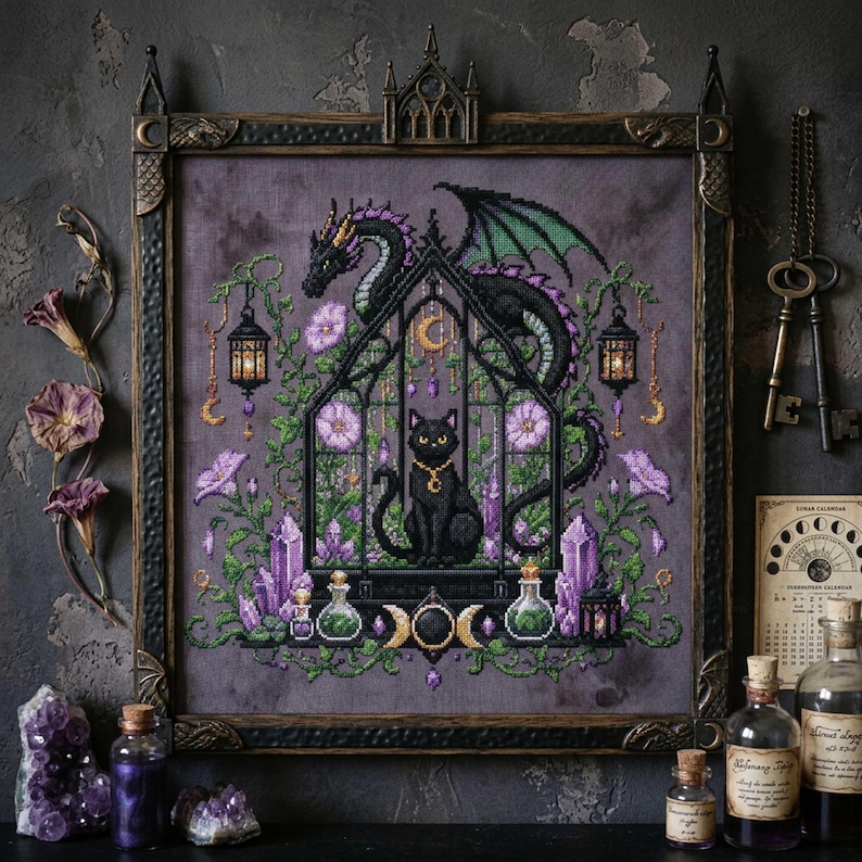 magical fantasy cross-stitch pattern featuring a black cat sitting inside a gothic greenhouse while a dark dragon with green wings curls protectively around the roof. The scene is decorated with lavender flowers, leafy vines, purple crystals, potion bottles, hanging lanterns, crescent moon charms, and celestial ornaments. The rich palette of black, green, lavender, gray, purple, and gold creates a mystical witchy garden mood, perfect for cat lovers, dragon fans, fantasy décor, and handmade walL