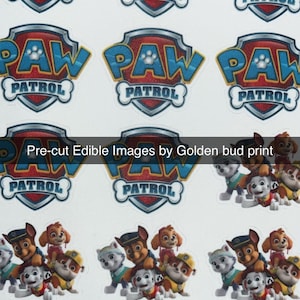 May include: Sheet of pre-cut edible images featuring the Paw Patrol logo and characters. The logo is in red, blue, and white. The text "Pre-cut Edible Images by Golden bud print" is also visible.