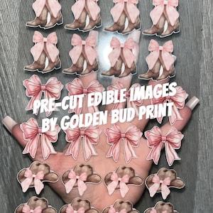 May include: Pre-cut edible images featuring cowboy boots with pink bows, cowboy hats with pink bows, and the text "PRE-CUT EDIBLE IMAGES BY GOLDEN BUD PRINT". The images are on a clear sheet.