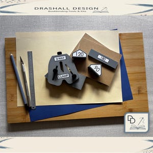 May include: A bookbinding kit with a bamboo cutting board, a gray clamp, a metal ruler, pencils, and angle guides labeled 90, 120, and 180 degrees. The kit includes a craft knife and various paper sheets.