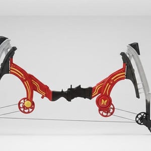May include: A compound bow with a red and gold frame, black accents, and silver limbs. The bow features a butterfly design on the side and a black string. The bow is designed for archery.