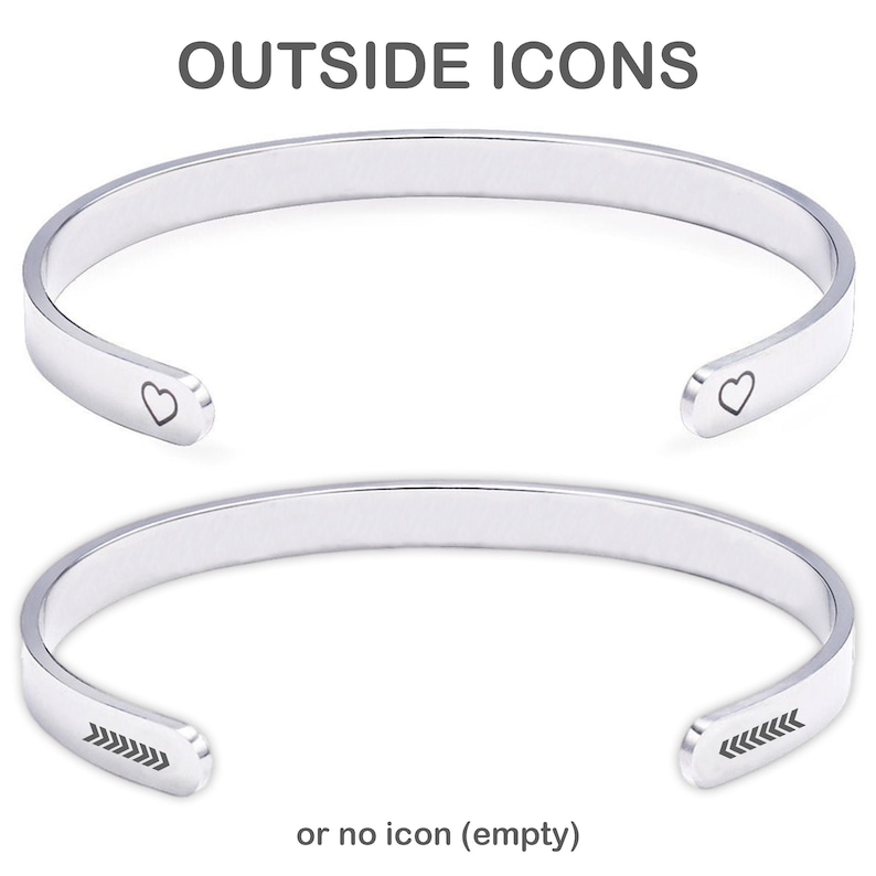 May include: Two silver-toned metal cuff bracelets. The top bracelet features a small heart icon engraved on each end. The bottom bracelet features a series of five small arrows engraved on each end. The text OUTSIDE ICONS and or no icon (empty) appears.