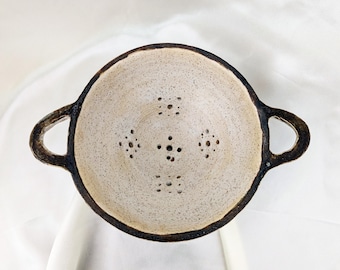 Handmade stoneware colander with black and white glaze — utilitarian ceramic, unique piece