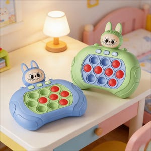May include: Two colorful, bunny-themed sensory toys. One is blue, the other green, each with red and green pop-it bubbles. The toys have a bunny face on top and buttons. They are designed for tactile play and sensory exploration.