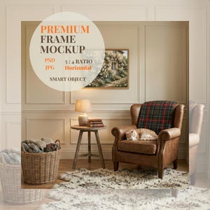 May include: A cozy interior scene featuring a framed landscape painting, a brown leather armchair with a plaid blanket, and a sleeping cat. A small side table with a lamp and books sits nearby. The text "PREMIUM FRAME MOCKUP" is visible.