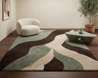 Peut inclure: Un tapis rectangulaire présentant un motif ondulé texturé dans des tons de brun foncé, vert sauge et crème. Le design se compose de lignes sculptées et fluides qui créent une impression de mouvement sur la surface du revêtement de sol.
