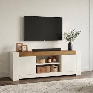 May include: A rectangular media console featuring a light wood-toned top surface and a white frame. The unit includes two side cabinets with solid doors and an open central section with two shelves containing woven baskets and glass jars.